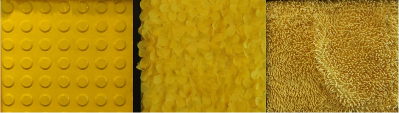 사진 설명 시작. 몬드리안 촉각명화 중 노란색 사각형들 세 개의 재질을 확대해 비교한 사진이다. 가장 왼쪽에는 점자 보도블록이, 중간에는 노란 조화의 꽃잎들이, 오른쪽에는 부드러운 노란색 양탄자가 직사각형을 채우고 있다. 사진 설명 끝.